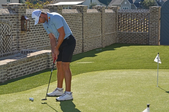 San Francisco Golfer putting on synthetic grass